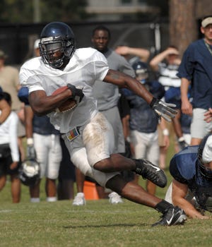 Georgia Southern running back Mike Hamilton cuts through the Eagles' defense Saturday during the first scrimmage of the spring.