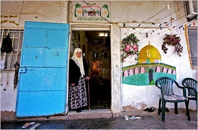 A Palestinian woman, Umm Aziz, at the entrance to her home in a Beirut refugee camp Friday. She is from a village that is now part of Israel.