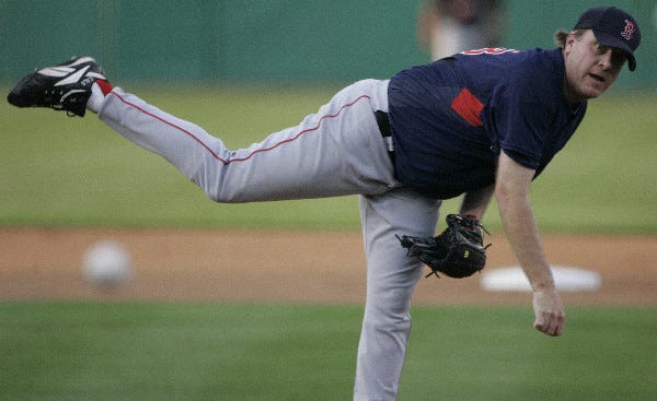 Boston Red Sox starter Curt Schilling delivers during the first inning against the Minnesota Twins during their spring training baseball game in Fort Myers, Fla., Wednesday, March 28, 2007. (AP Photo/Charles Krupa)