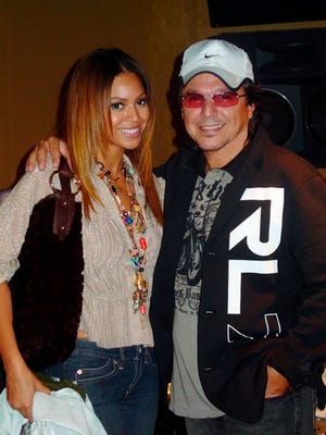 Producer Rudy Perez poses with Beyoncé in Miami last year. Perez, the go-to man for Spanish lyrics, started the crossover work with Christian music star Jaci Velasquez, who is Mexican-American, then worked with Christina Aguilera for her 2000 album.