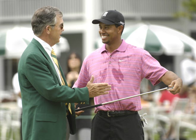Augusta National Chairman Billy Payne jokes around with four-time Masters champion Tiger Woods on the practice green at the Augusta National Golf Club, Sunday, April 1, 2007, in Augusta, Ga. The Masters begins Thursday, April 5.(AP Photo/Augusta Chronicle, Andrew Davis Tucker)