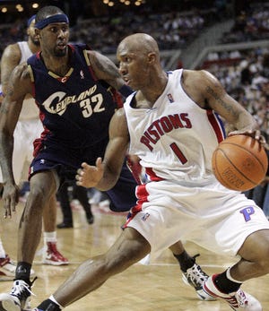 Detroit Pistons guard Chauncey Billups (1) puts a move on Cleveland Cavaliers guard Larry Hughes (32) in the second half of a basketball game Sunday, April 8, 2007, in Auburn Hills, Mich. Billups scored 14 points and dished out 12 assists in an 87-82 win. (AP Photo/Duane Burleson)