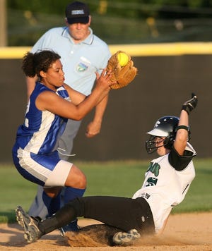 Forest's Staci Cauthen, right, slides into second base as Belleview's Stephanie Hill tries to make the tag on Thursday at Forest High School. Cauthen was safe on the play.