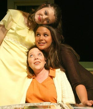 Babe, played by Kasey McCarver, top, Meagan Jennings as Meg, center, and Jenny Ryan as Lenny remember the good old days in the Theater Tuscaloosa production of "Crimes of the Heart."