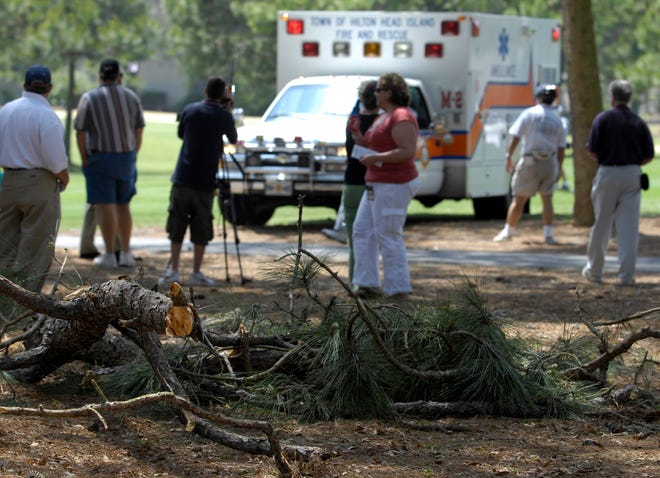 A volunteer marshal at the Verizon Heritage golf tournament was transported by ambulance after being struck by a tree branch shaken loose by high winds on the 9th Fairway.