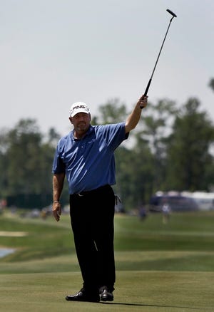 Mark Calcavecchia celebrates after a birdie on the 18th hole at the Zurich Classic on Friday. Calcavecchia shot a 69 in the second round and is nine under par.