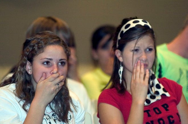 Forest High School sophomores Heather Buss, left, 16, and Chelsey Moore, 16, react Tuesday to a story of atrocities against Armenians.
