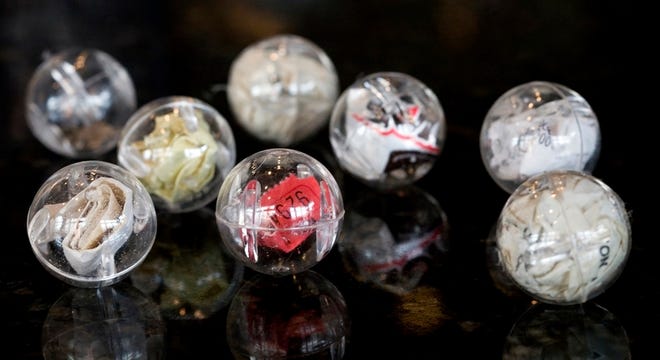 Trashballs are 1-inch plastic orbs containing objects artist Christopher Goodwin finds on the streets.