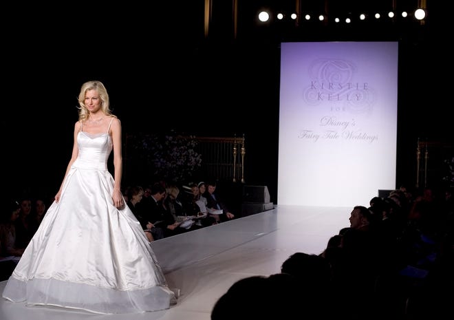 A model walks the runway showing Kirstie Kelly for Disney’s Fall Fairy Tale Weddings dresses Sunday in New York City.