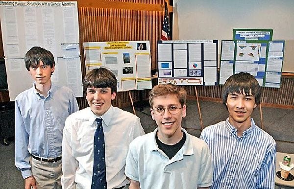 Falmouth High School and Falmouth Academy students, from left, Neil Forrester, Matthew Pickart, Max Mann and Kevin Lin presented science projects in Woods Hole Tuesday. Forrester’s project earned first place yesterday in Boston.