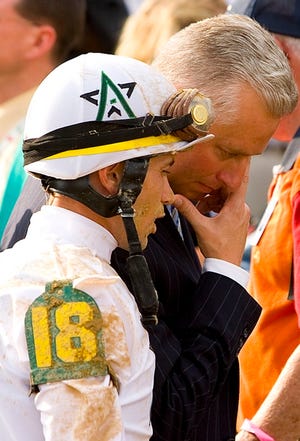 Trainer Todd Pletcher, right, who is now 0-19 in the Kentucky Derby, talks with Any Given Saturday jockey Garrett Gomez after Street Sense won the Derby.