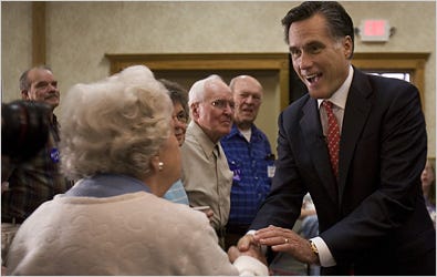 Republican presidential hopeful Mitt Romney greets potential supporters in Clear Lake, Iowa.