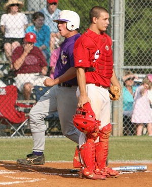 Bibb County’s Cannon McDonald, left, scores a run in the second inning as St. Paul’s catcher Shawn Collins looks on during the Class 5A semifinals Friday at Bibb County High School. Bibb County swept the series and advances to the state finals next week in Montgomery against Cullman or Russellville.
