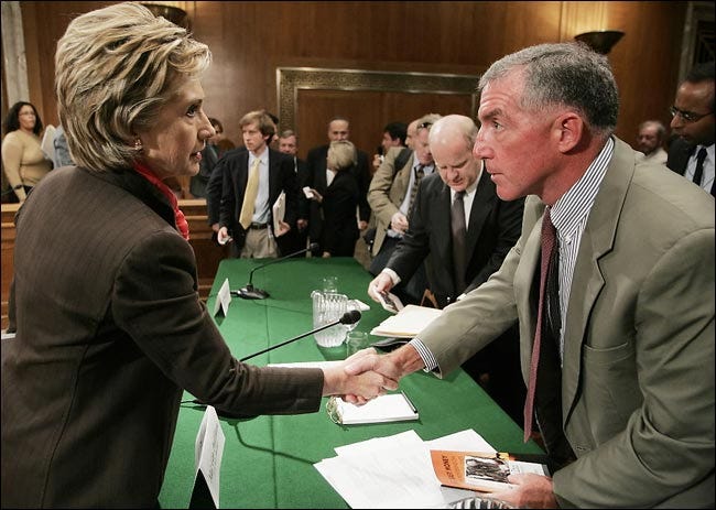 Paul D. Eaton, a retired major general who is also part of the advertising campaign, at a hearing in 2006 with Senator Hillary Rodham Clinton.