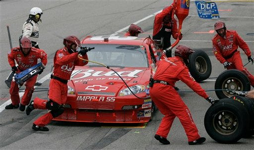 Dale Earnhardt Jr.'s pit crew services his car during the NASCAR Nextel Cup Dodge Avenger 500 auto race Sunday, May 13, 2007, at the Darlington Raceway in Darlington, S.C