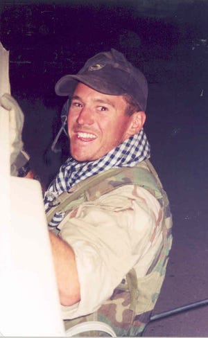 Capt. Jeremy Chandler donning an Afghani scarf. The photo is a favorite of retired Lt. Col. Al Chandler and Jonnie Chandler, Jeremy's parents.