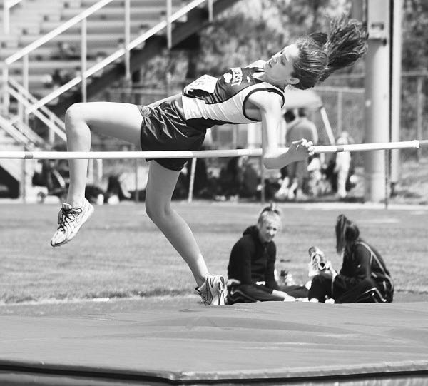 JULIE DESROSIERS: is shown clearing the high jump bar for Somerset High School’s girls tracks team.
