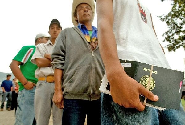 Mexicans line up outside the U.S. Consulate in Monterrey, Mexico, as they wait for a working visa interview yesterday.
