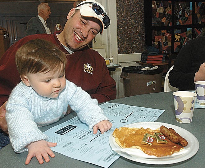 Mike Mealey and his doughter Evelyn 8months old enjoy pancakes at Taunton Rotary's annual Pancake Day