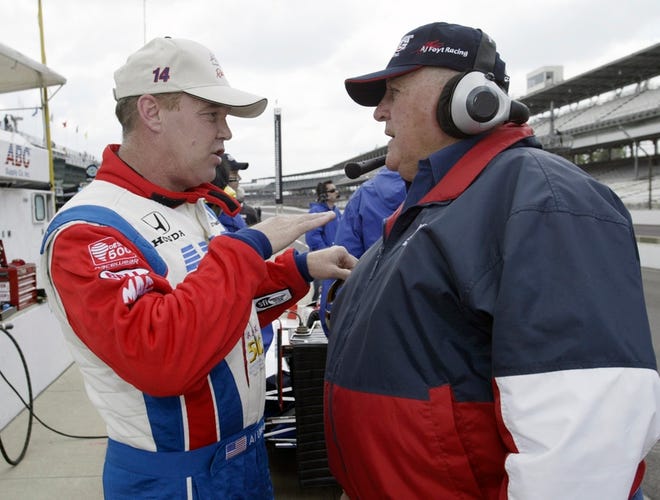 Al Unser Jr., left, talks strategy with car owner A.J. Foyt during a practice session at the Indianapolis Motor Speedway. Unser, a two-time Indy 500 winner, is attempting to qualify for next weekend's race.