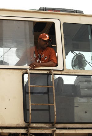 Darryl Perry drives the shielded canister transporter at the Savannah River Site.