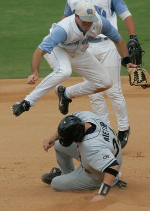 North Carolina shortstop Josh Horton, top, leaps to avoid the slide of Georgia Tech's Matt Wieters as he completes a double play during the fifth inning at the ACC baseball tournament Wednesday, May 23, 2007, in Jacksonville, Fla. Georgia Tech won 8-4. (AP Photo/Phil Coale)