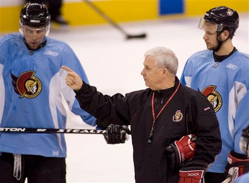 Ottawa Senators coach Bryan Murray talks with Dany Heatley, left, and Jason Spezza during hockey practice in Ottawa, Ontario, Canada, Friday May 18, 2007. The Senators lead the best-of-seven Eastern Conference final series 3-1 against the Buffalo Sabres. Game 5 in Buffalo is Saturday, May 19.