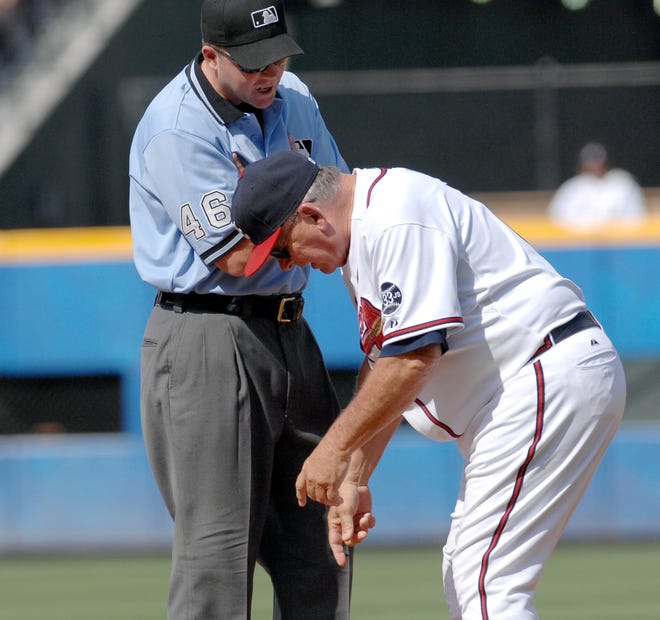 Braves manager Bobby Cox, right, argues a call about the base line with first base umpire Ron Kulpa, left, during the third inning against the Philadelphia Phillies at an Major League Baseball game, Saturday, May 26, 2007, at Turner Field in Atlanta. Cox was ejected from the game during the talk. (AP Photo/Gregory Smith)