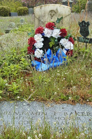 The gravesite of Benjamin F. Baker, the only Barnstable County native to earn the Medal of Honor, is overgrown at Swan Lake Cemetery in Dennis.