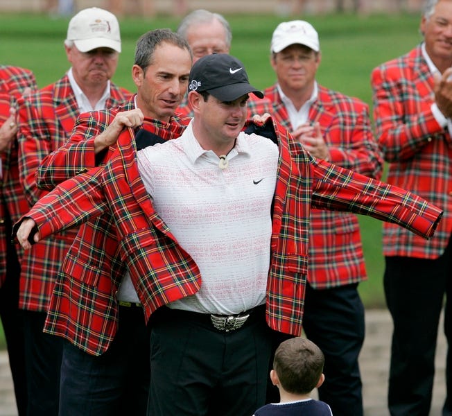 Dow Finsterwald presents the plaid jacket to Rory Sabbatini after Sabbatini won the Colonial on Sunday.