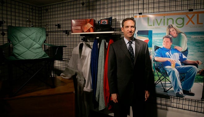 David Levin, Casual Male Retail Group CEO, poses with a sampling of the company's new "Living XL" collection at its corporate headquarters in Canton, Mass., on May 22. Casual Male Retail Group is the nation's largest chain of men's plus-size clothing and apparel stores.