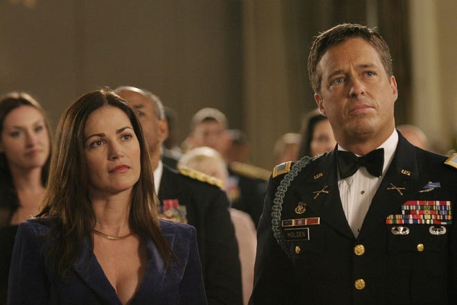 Kim Delaney, left, and Brian McNamara, who plays her husband, attend the Military Ball in the first episode of "Army Wives," premiering tonight on Lifetime.