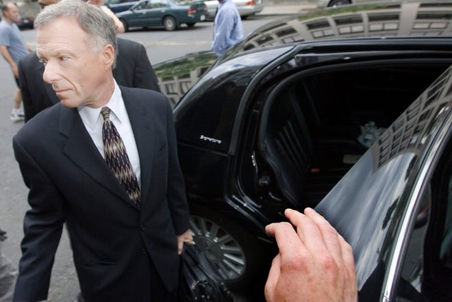 I. Lewis "Scooter" Libby leaves federal court in Washington after he was sentenced Tuesday.