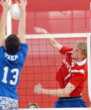 Natick's Shaun Sibley rips a cross-court kill against St. John's Prep in the State semifinal victory.