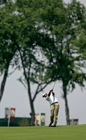 Vijay Singh hits off the fourth fairway during Wednesday's practice round for the 107th U.S. Open at Oakmont Country Club in Pennsylvania. The course plays comparable to many others from tee to fairway, but changes drastically on and around the greens.