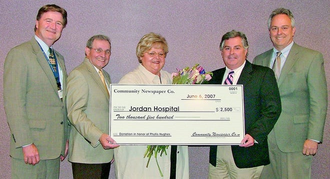 The Community Newspaper Company makes a donation to Jordan Hospital’s cardiovascular campaign in honor of Phyllis Hughes. From left: Alan Knight, president & CEO of Jordan Hospital; Ed Santos, chairman of Jordan Hospital’s Campaign for Cardiovascular Excellence; Phyllis Hughes; Mark Skala, CNC/South-Cape editor-in-chief; and Scott Smith, CNC/Plymouth managing editor.