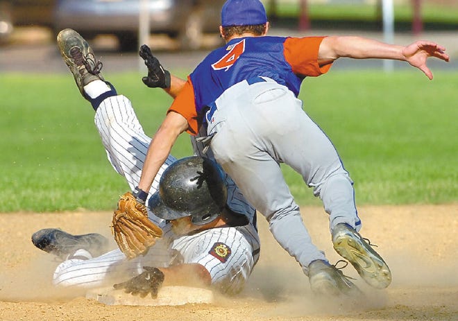 Kemp's Jeremy Bonser slides safely under the tag of Nazereth's Craig Ball on a run-scoring double in the first inning of their NORCO Legion baseball game at Stroudsburg High School on Friday. Kemp won 9-2.