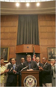 Michael Moore appearing with House members last week on Capitol Hill, where he is promoting his film and a plan to guarantee health care.