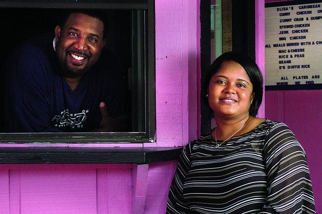 Ray and Elisa Wood stand inside Elisa's Caribbean Pot in Bolivia on Wednesday. The two plan to open up the restaurant Tuesday.
