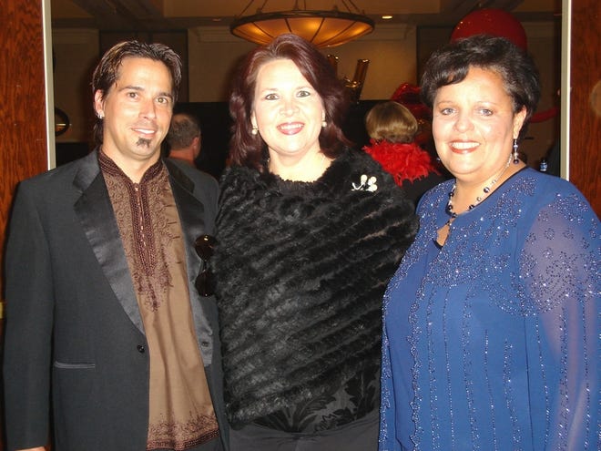 Doug Snyder, Lola Gonzalez and Vicky Gonzalez attend the Women of Worth event at the Ocala Hilton. At left, George and Linda Logan and Ron Ewers. Below left, Paul and Faith Sarfarazi.