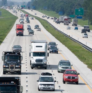 Motorists travel south on I-75 Monday before the start of the July 4th holiday.