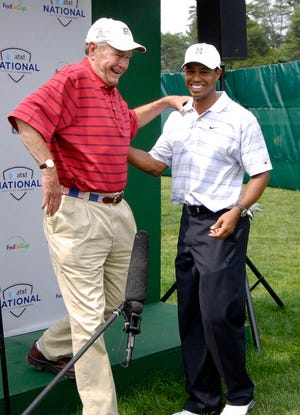 Tiger Woods, right, talks with former U.S. President George H.W. Bush, after Woods played in the the AT&T Earl Woods Memorial Pro-Am on Wednesday.