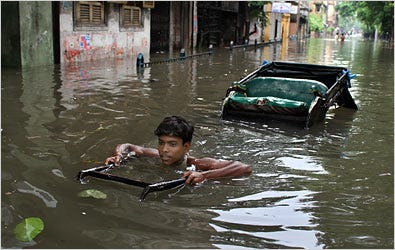 The monsoon season in India is always awesome and erratic. The death toll in flooding so far this year has surpassed 500 across India. A rickshaw puller in Calcutta coped with a particularly heavy downpour this week.