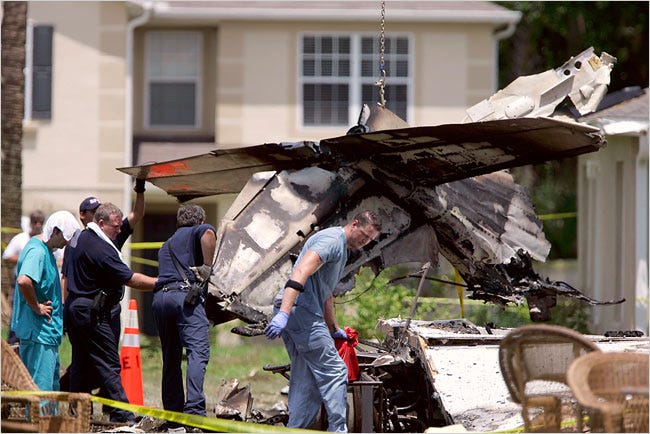 Officials began sifting through the wreckage of a small plane that crashed and burned Tuesday in a suburb near Orlando, Fla.