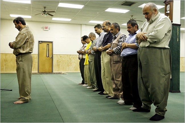 At the Salahadeen Center, a mosque and neighborhood gathering place of Kurdish immigrants here, Salah Osman leads an afternoon prayer.