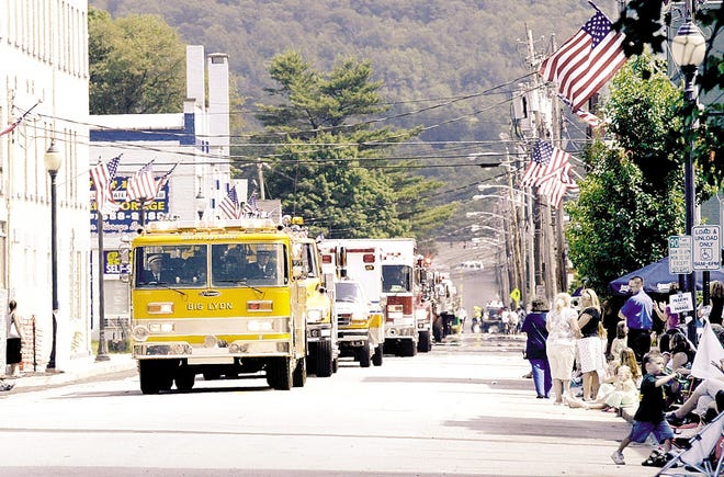 ABOVE: Vehicles from the Westfall, Pa., Volunteer Fire Department proceed yesterday along Jersey Avenue for the Port Jervis Fireman’s and Centennial Parade.