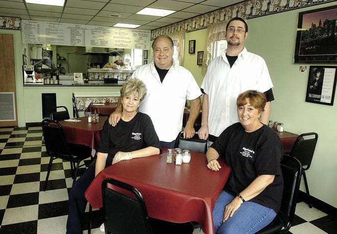 Clockwise from back left: Owner Gary Brockler, Chef Ray Land, owner Mary Ann Spencer and owner Sharon Brockler run the new Rigatoni's Italian Cafe in Penfield's Four Corners.