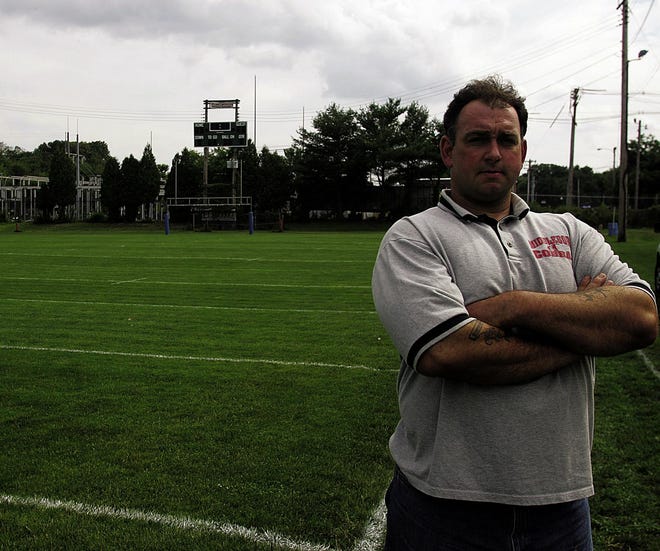 Middleboro Cobras new head coach and owner Garrett Perry stands on Battis Field Friday.