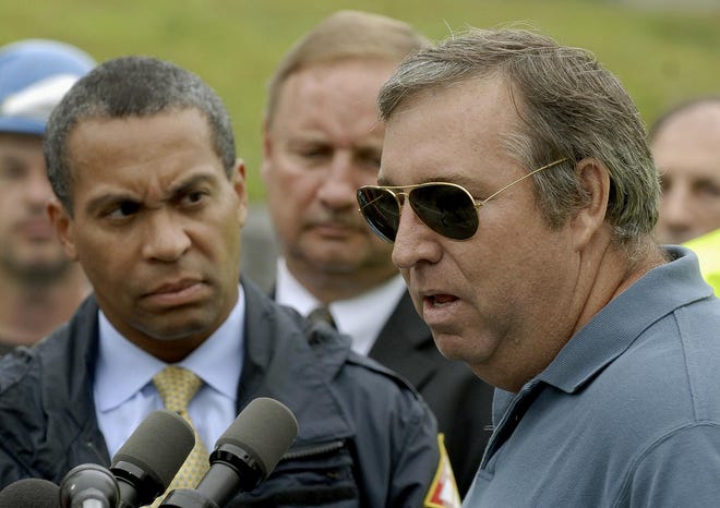 Bernat Mill owner Jack Tweed talks to the press while Gov. Deval Patrick looks on in Uxbridge yesterday. Local, state and federal officials toured the area after the fire.