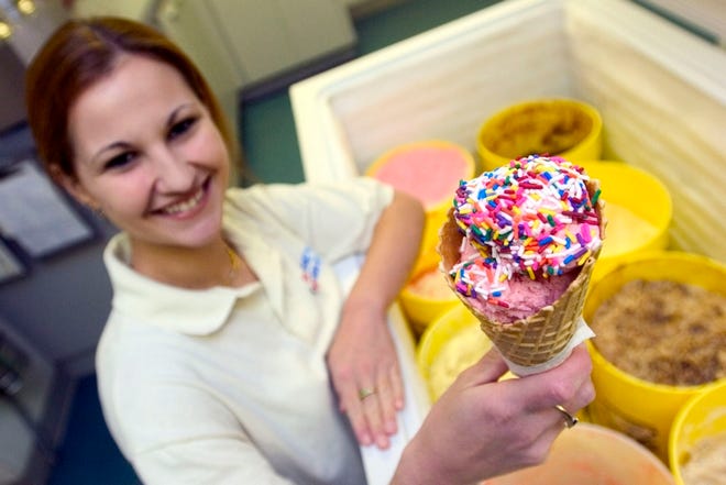 Assistant manager Lori Heise offers sugar-free strawberry ice cream at Sunset Delights on U.S. 441 in Summerfield.